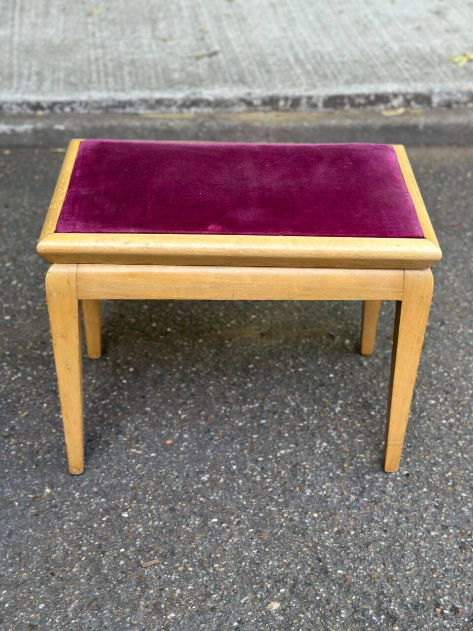 Adjustable piano stool in light beech and purple velvet.