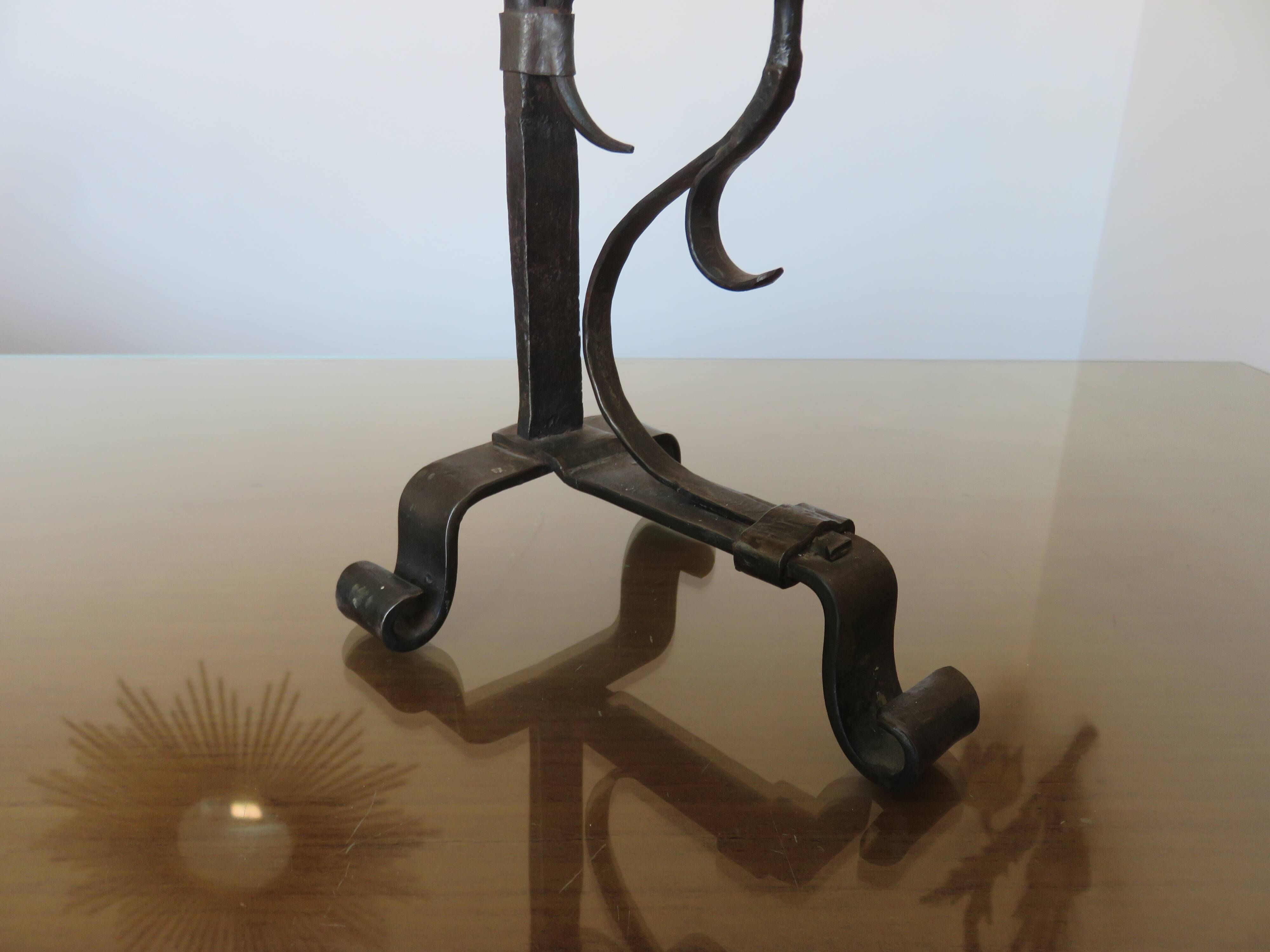 Brutalist candlestick in blackened wrought iron from the 1940s-50s.