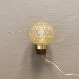 Wall light in rosewood with bobble glass ball shade.