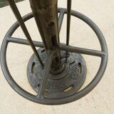 Unique bistro table with its adjustable industrial cast iron leg