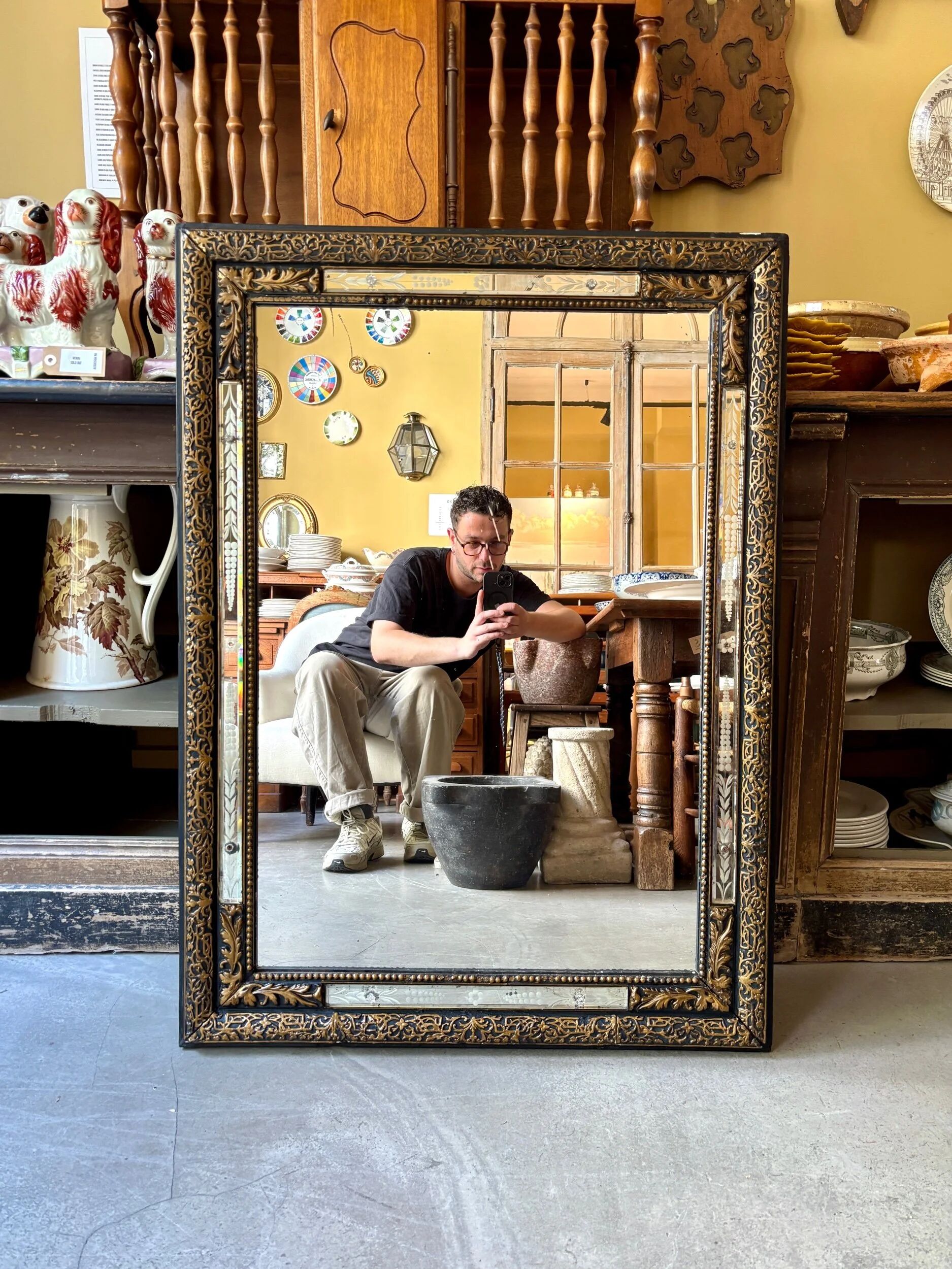 Rectangular Napoleon III mirror in moulded black and gold wood with engraved mirror decoration.