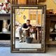 Rectangular Napoleon III mirror in moulded black and gold wood with engraved mirror decoration.