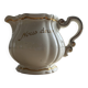 Old cream jug "Nous deux" in Sarreguemines earthenware.