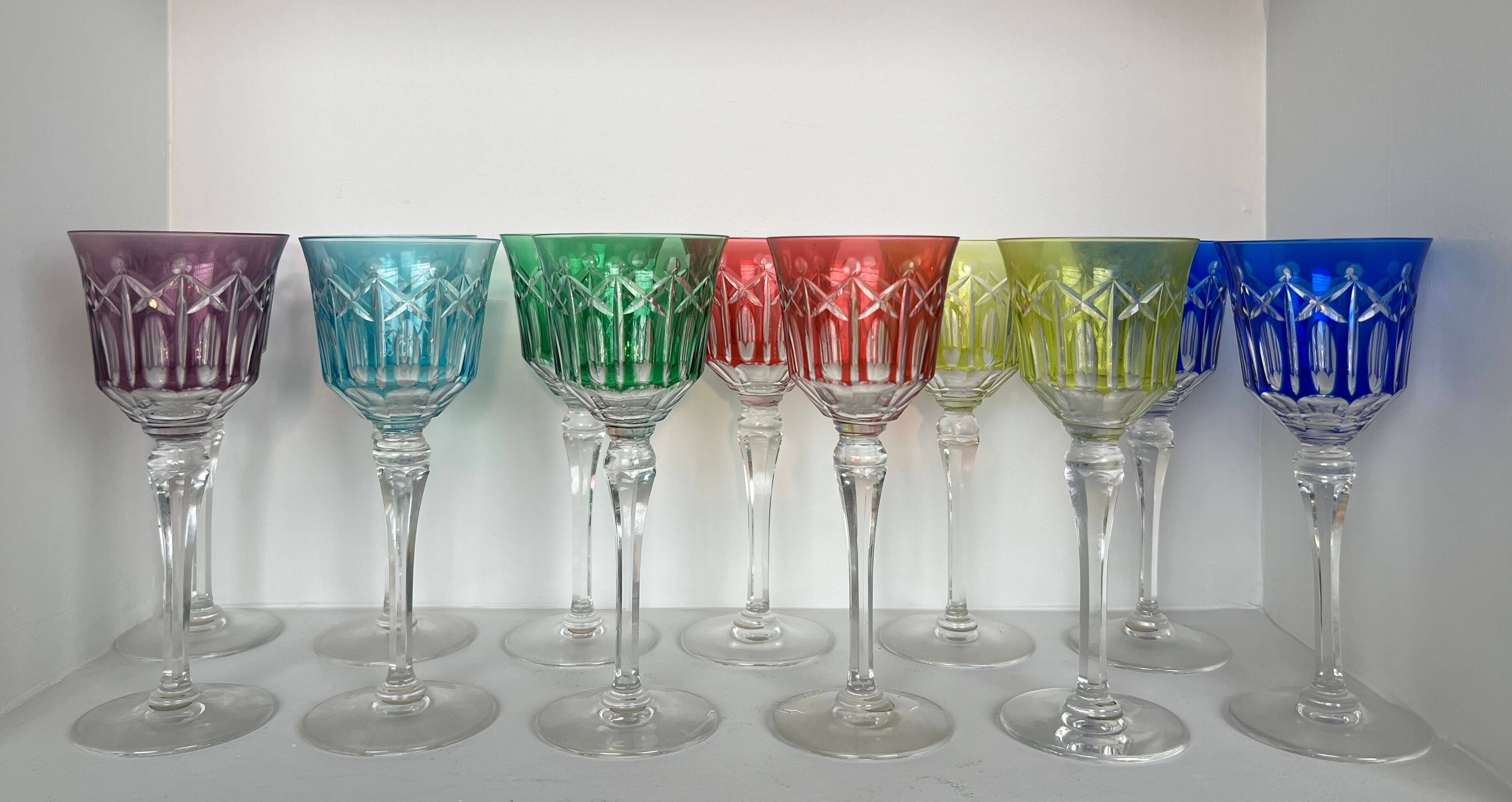 Set of twelve glasses in crystal tinted in different colours and cut with stars.