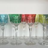 Set of twelve glasses in crystal tinted in different colours and cut with stars.