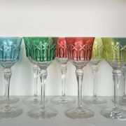 Set of twelve glasses in crystal tinted in different colours and cut with stars.