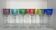 Set of twelve glasses in crystal tinted in different colours and cut with stars.