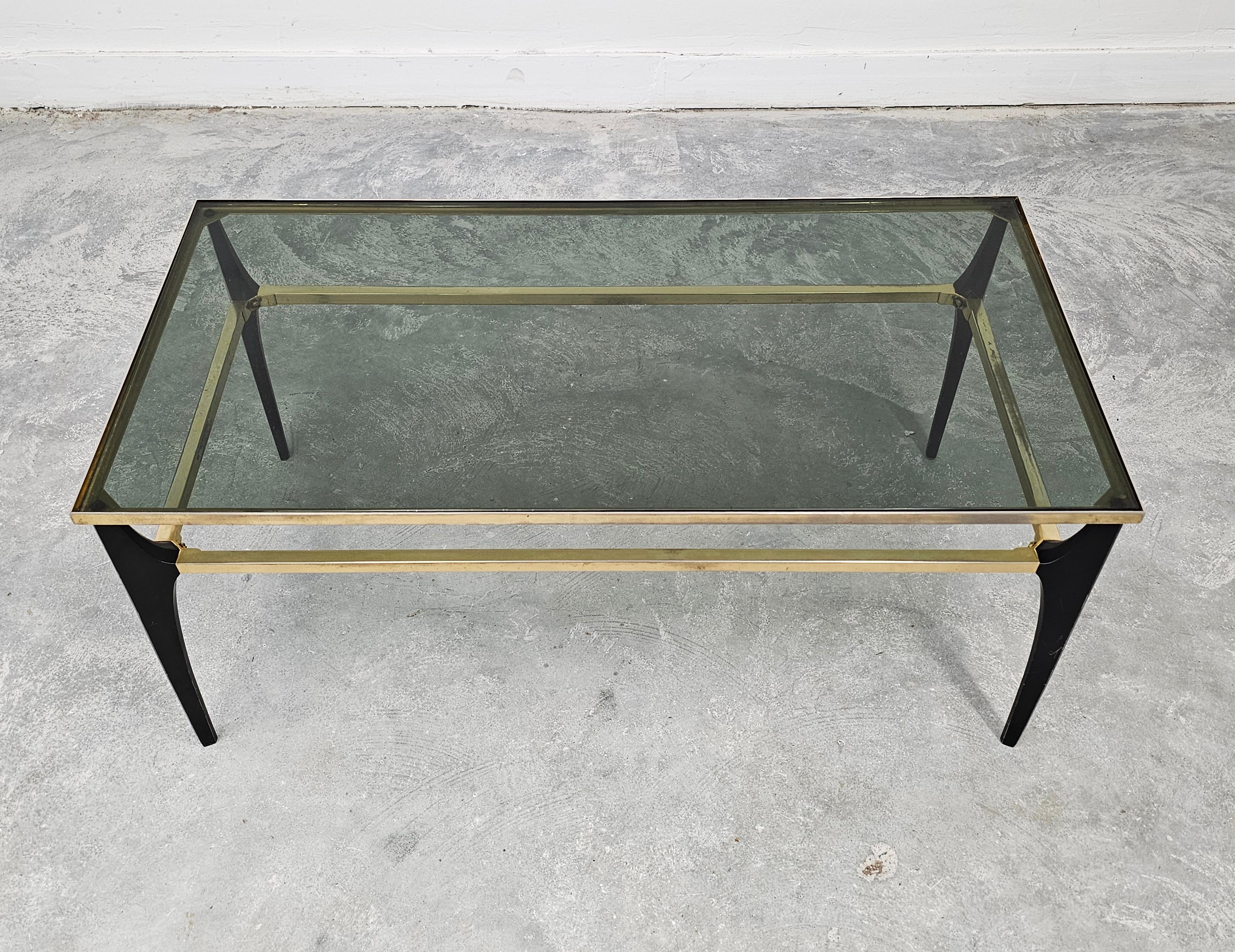 Mid Century Modern coffee table with gold-plated metal and smoked glass.