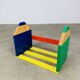 Wall-mounted pencil shelf for children, Pierre Sala style.