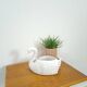 vintage porcelain flower pot in the shape of a swan