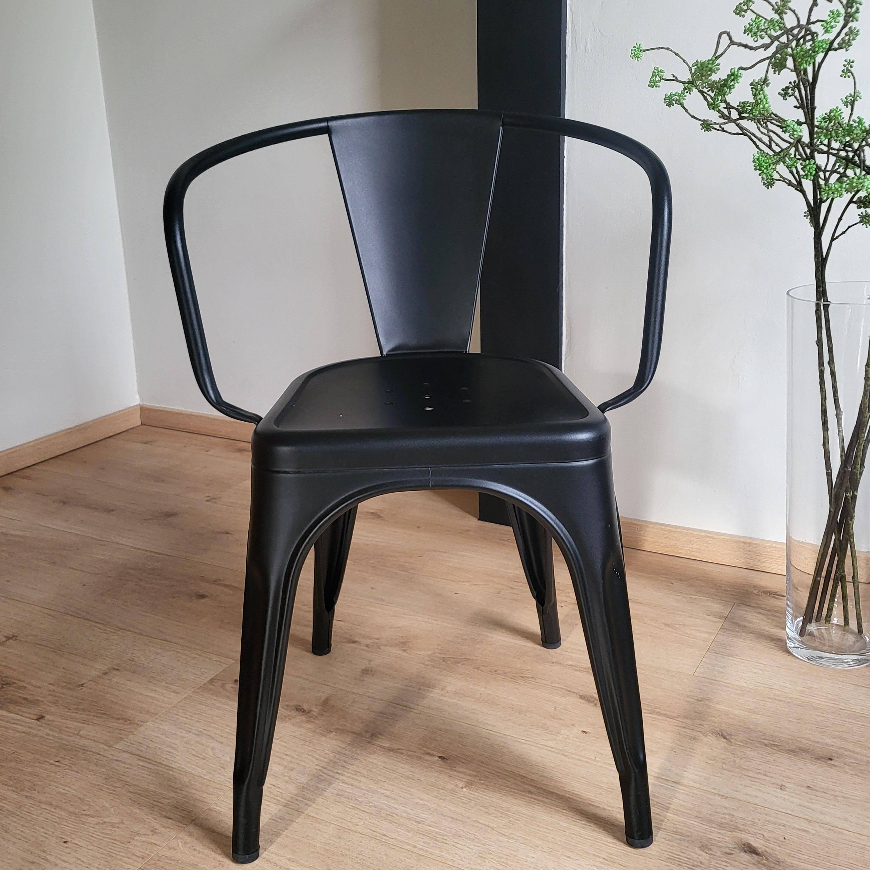 Black Tolix chair with armrests