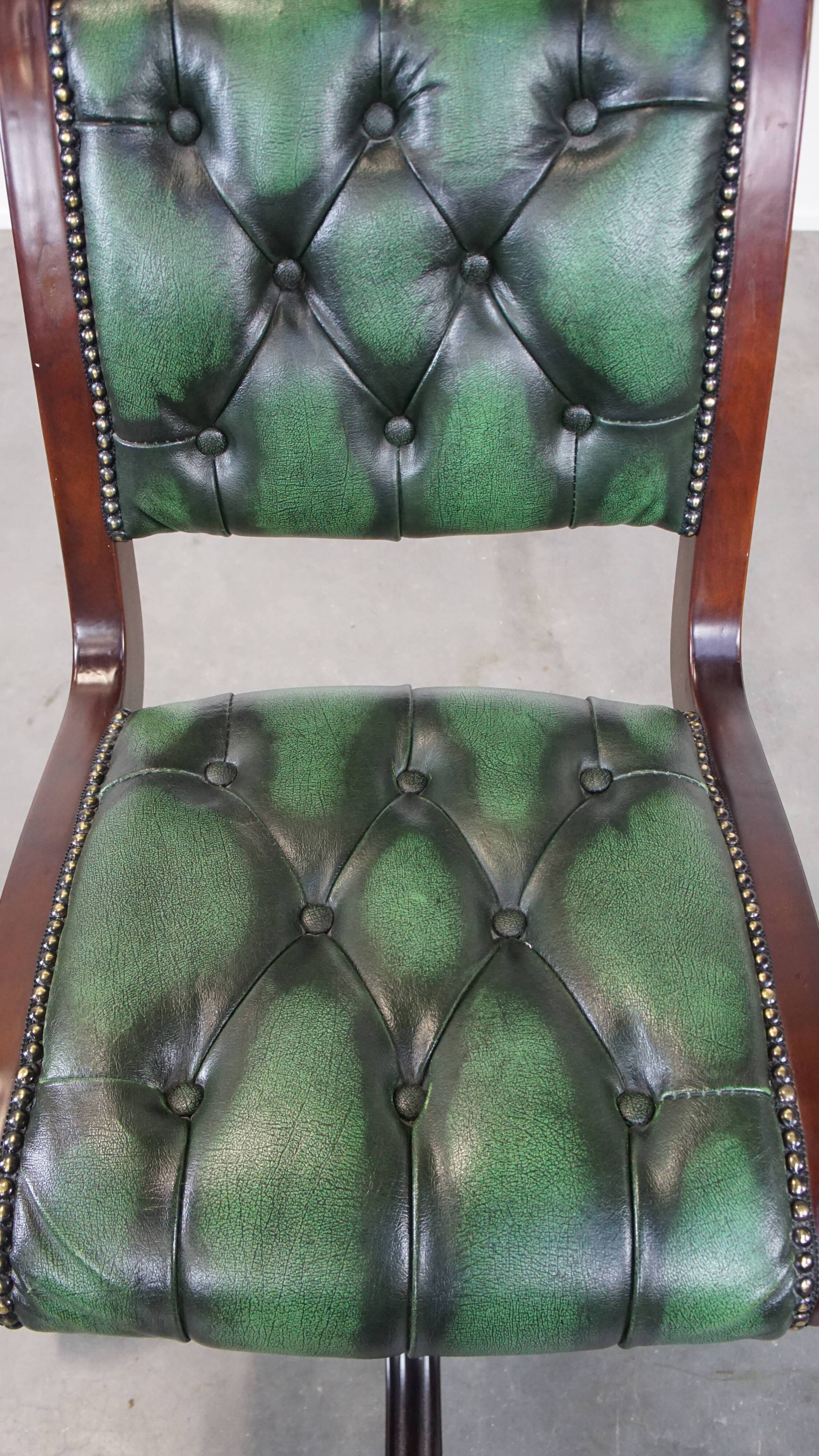 English Chesterfield office chair in green leather, height adjustable on casters