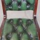 English Chesterfield office chair in green leather, height adjustable on casters