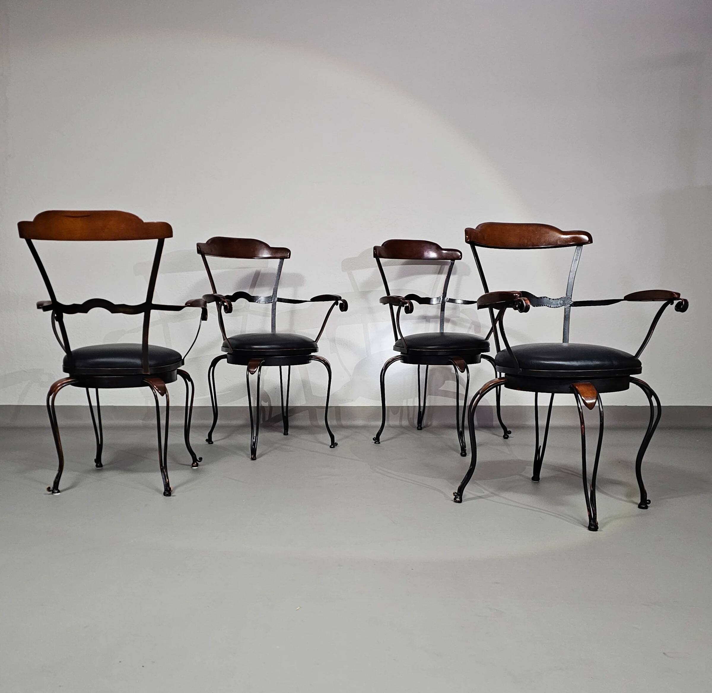 Italian postmodern turnable wrought iron dining chairs with leather seats