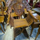 Pair of curule armchairs in solid teak circa 1980