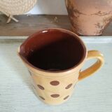 Old pitcher or polka dot vase