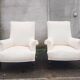 Paire de fauteuils en tissu écru et bois