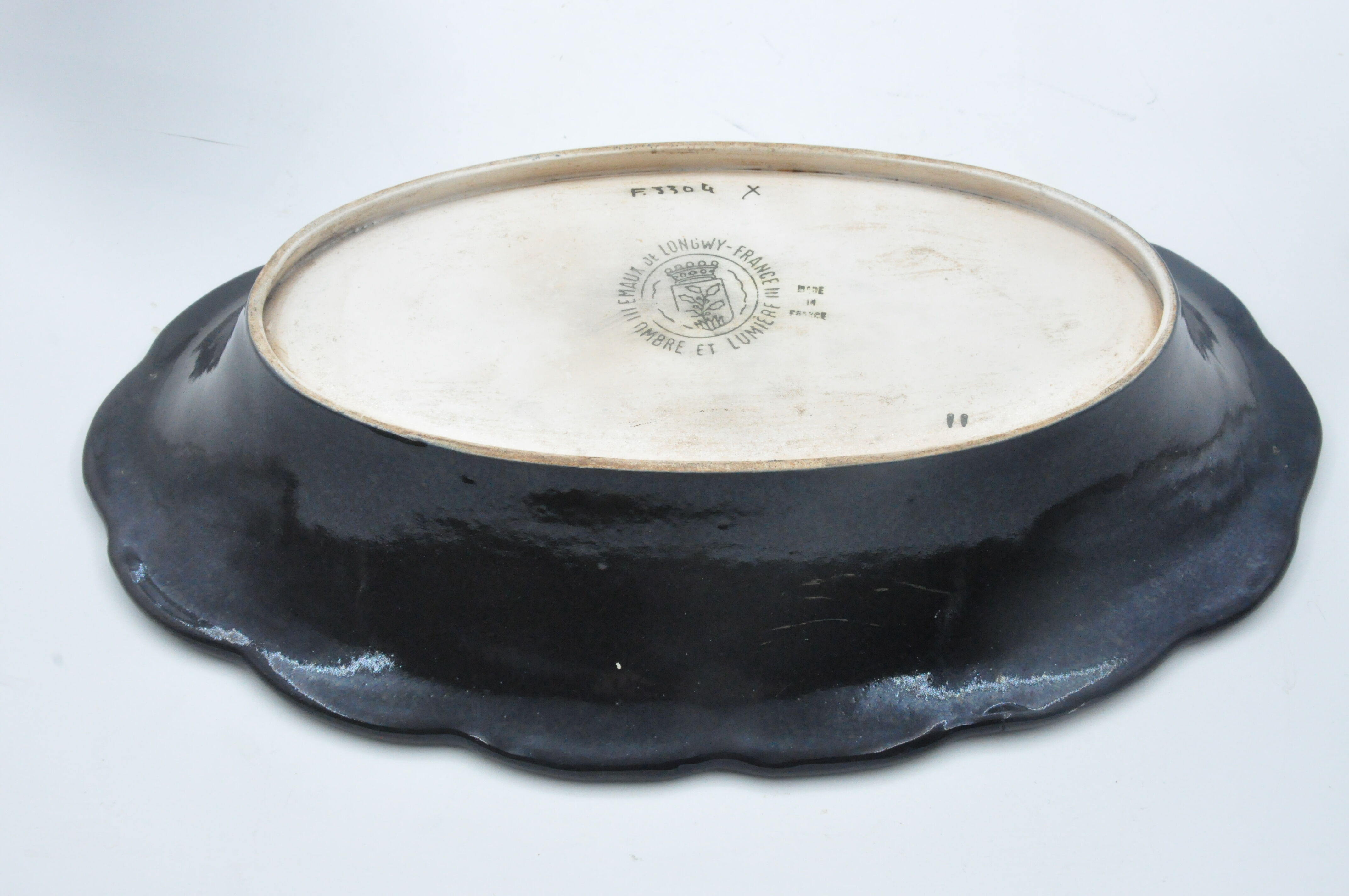 Old dish in enamels from longwy ombre et lumière collection ceramic design