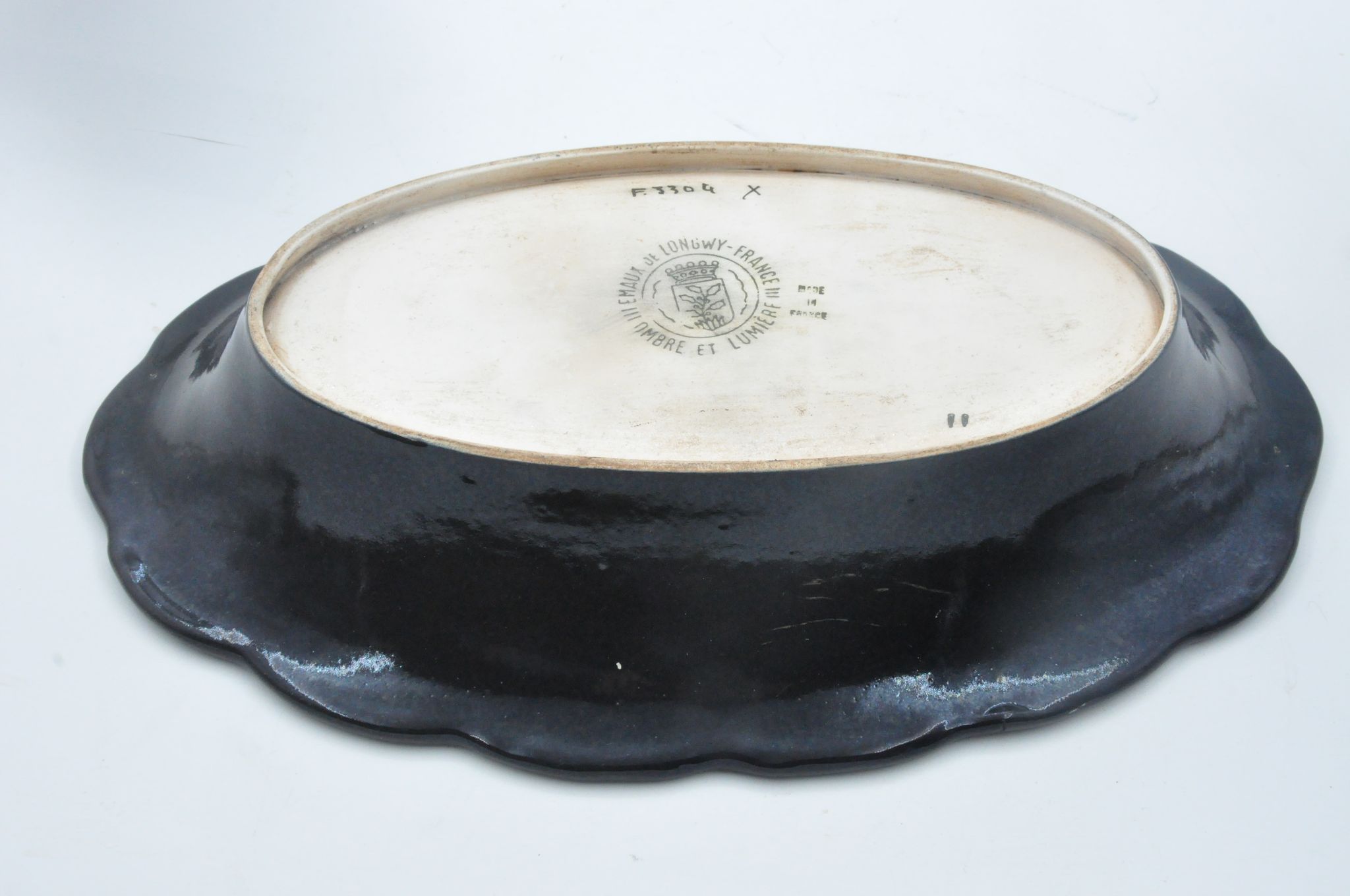 Old dish in enamels from longwy ombre et lumière collection ceramic design