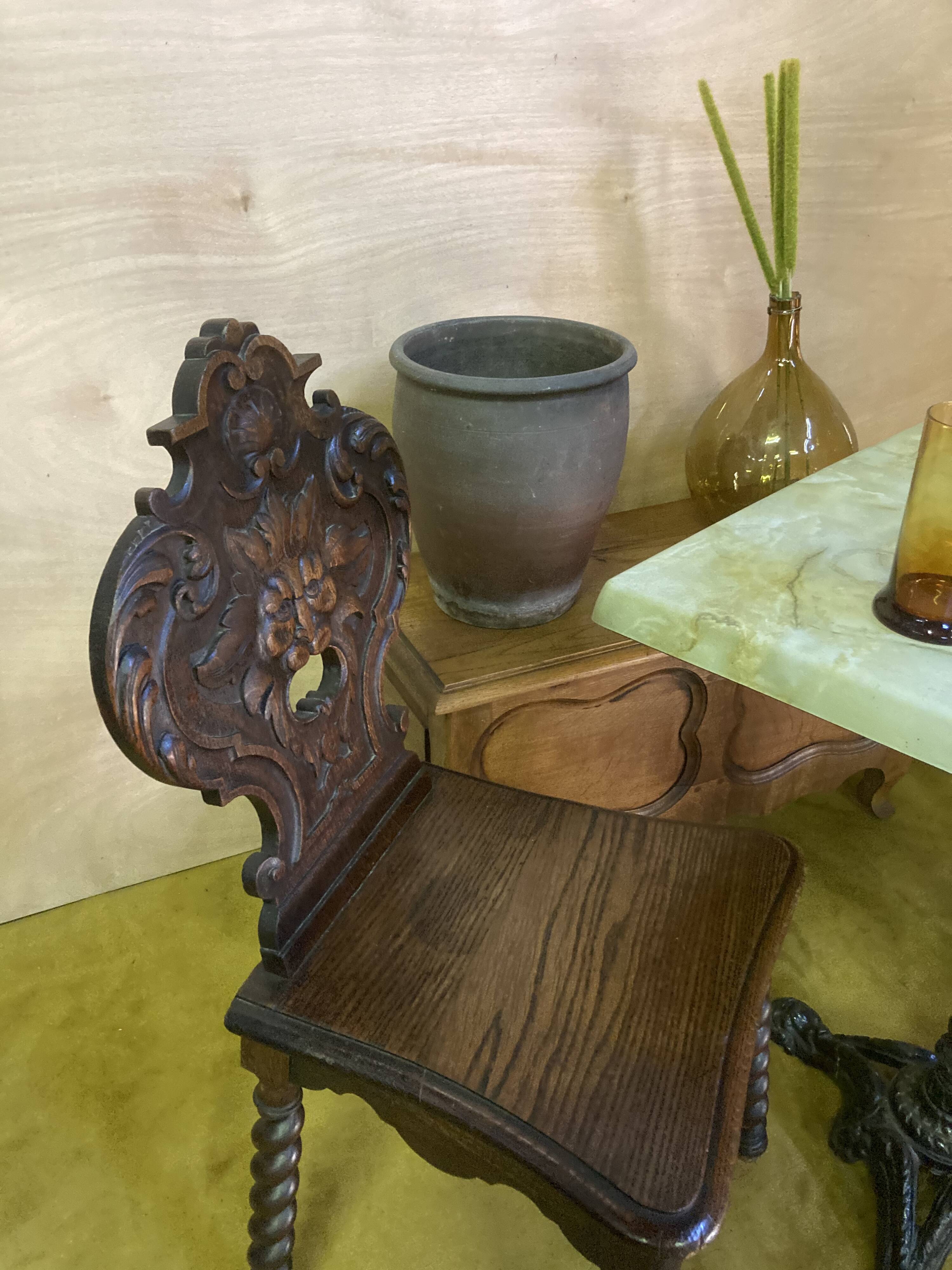 Duo of carved wooden chairs