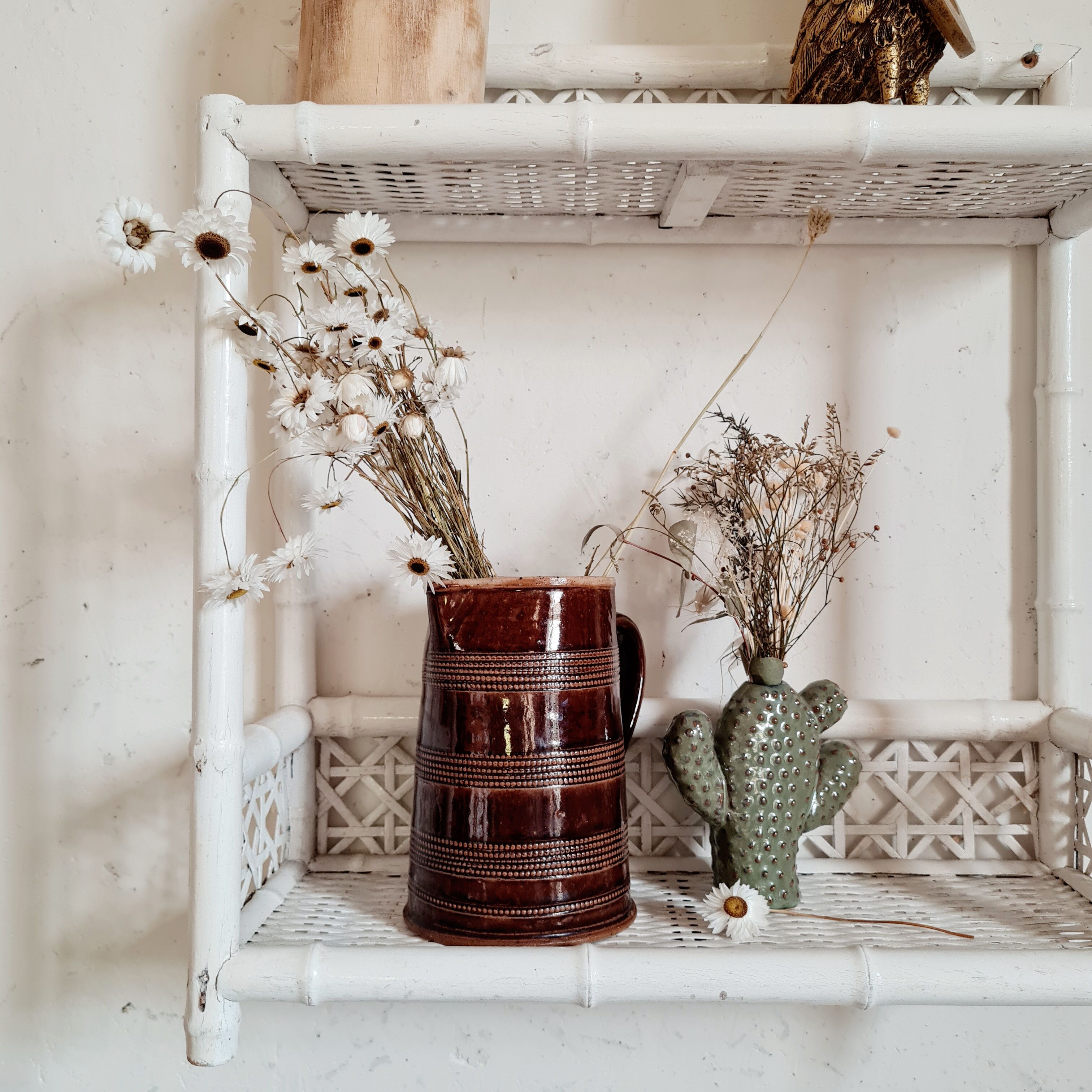 Vintage rattan and bamboo shelves painted white