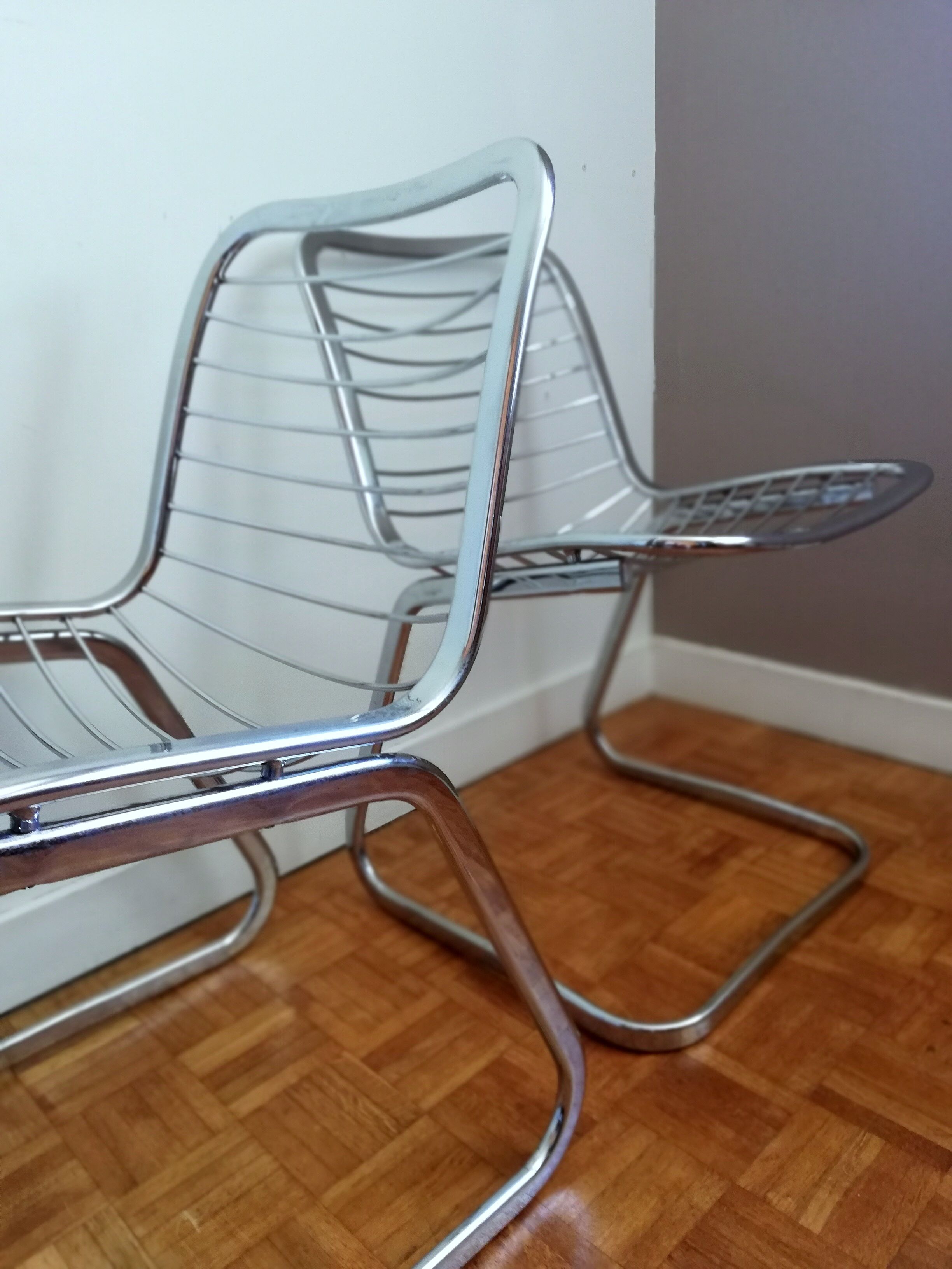 2 chrome wired chairs