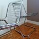 2 chrome wired chairs