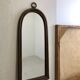 A rattan and bamboo mirror
