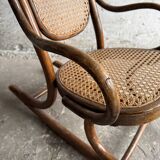 Warm walnut bentwood and cane child's rocking chair early 20th-century