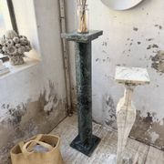 Set of 4 marble columns or pedestals.