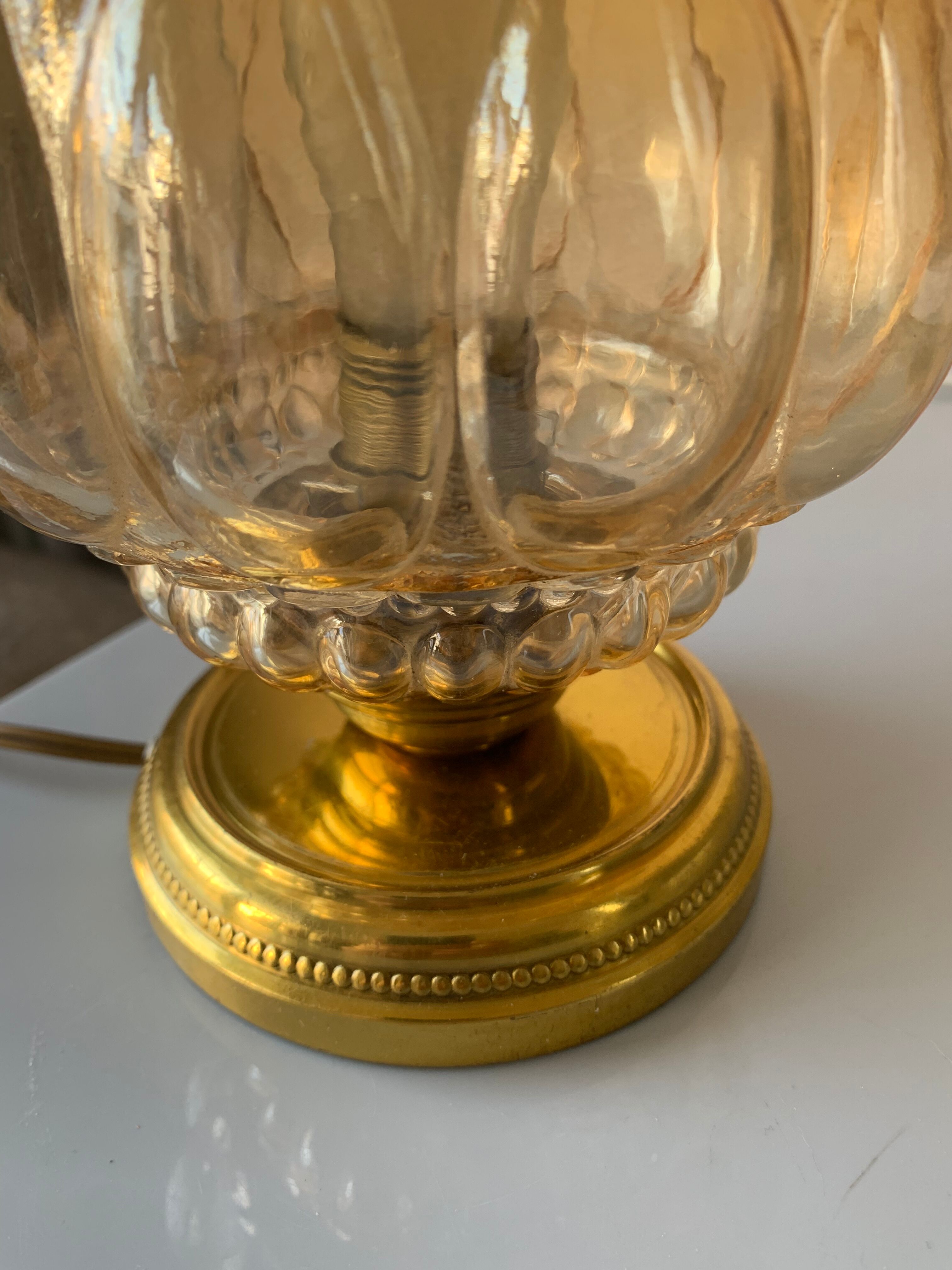 Old vintage table lamp made of amber molded glass