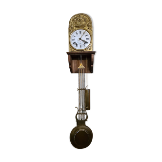 Comtoise clock with antique pendulum