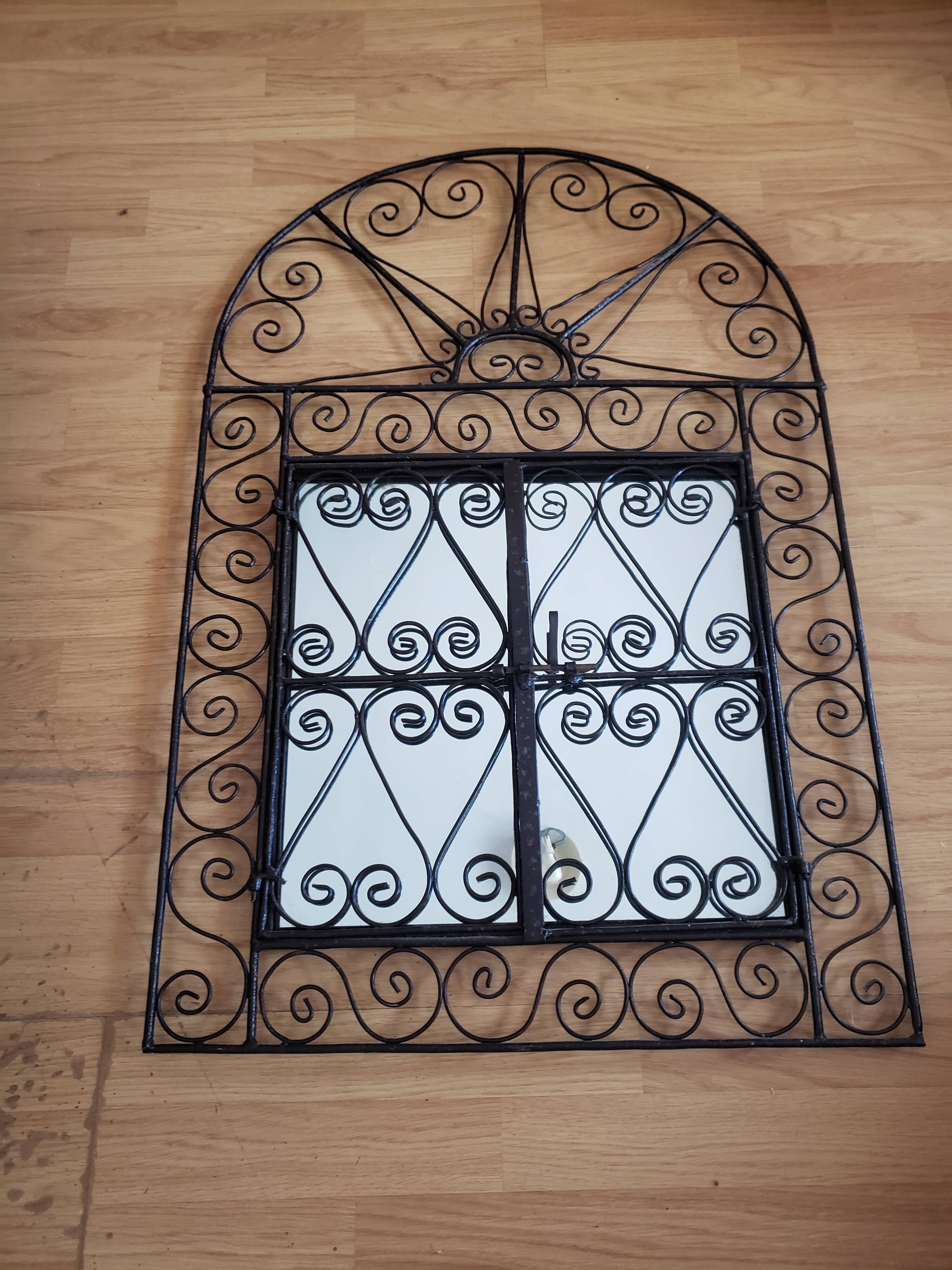 Oriental mirror with wrought iron door