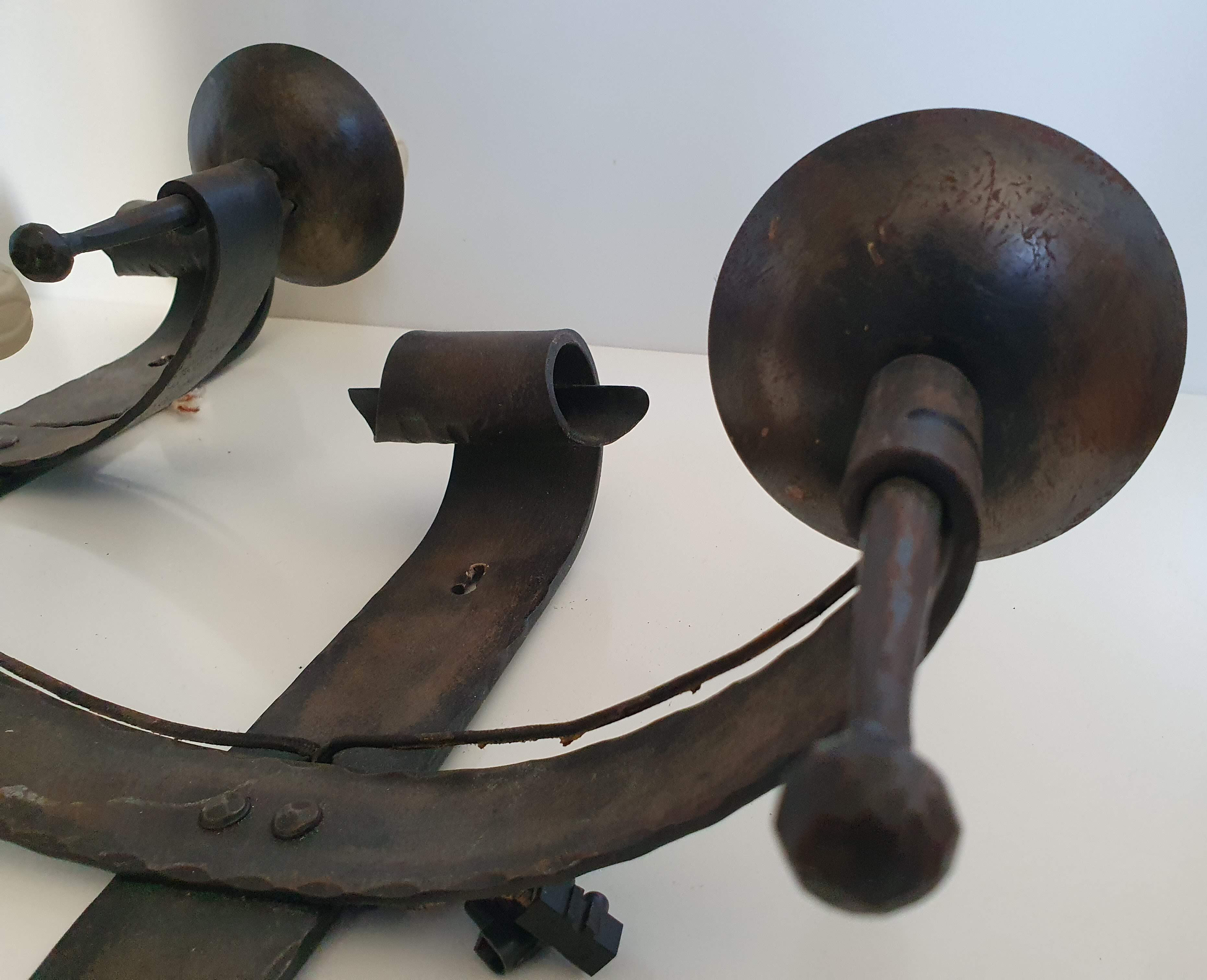 Duo of wrought iron wall lamps by Jean Touret Atelier Marolles