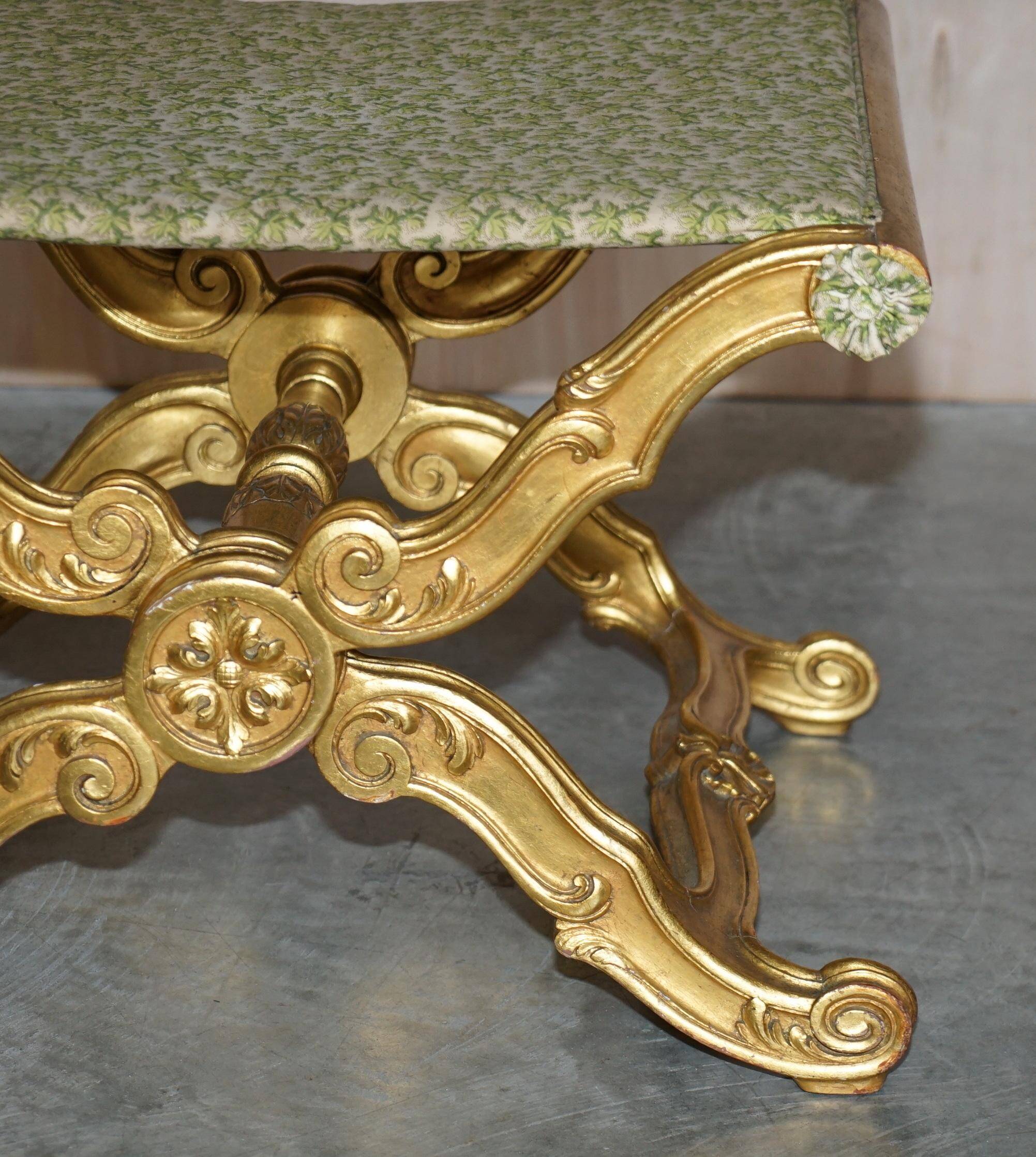 Folding stool with X-frame, carved golden wood, 19th century.