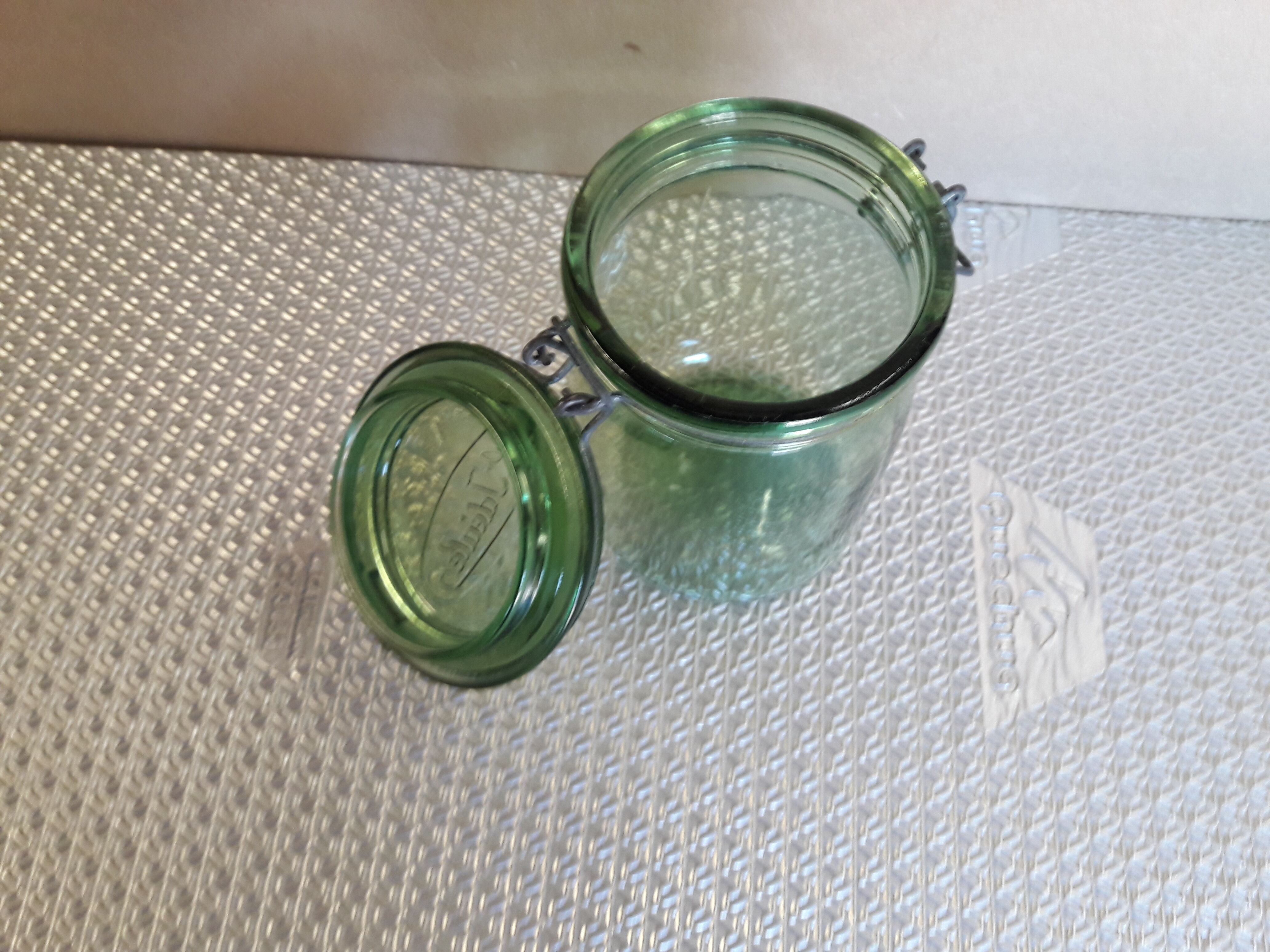Green glass jar l l 'ideal