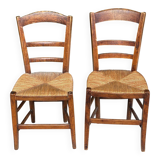 2 solid oak and straw wood chairs