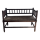 Turned wood bobbin bench with a straw seat.