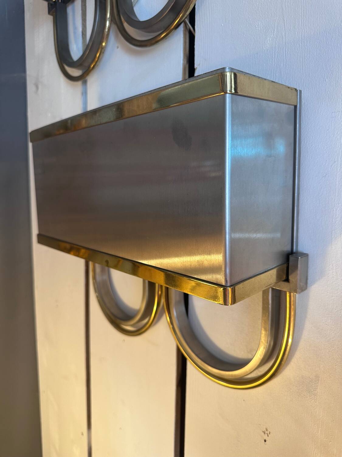 Pair of stainless steel and brass wall lights