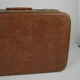 Cardboard and brown leather case