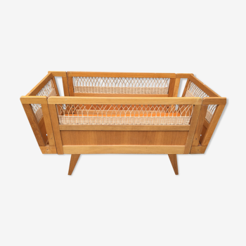 Wooden and rattan baby bed