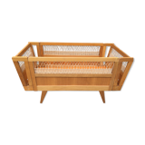 Wooden and rattan baby bed