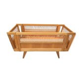Wooden and rattan baby bed