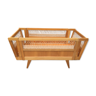 Wooden and rattan baby bed