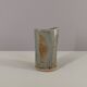Signed vase in enamelled sandstone with stylized face
