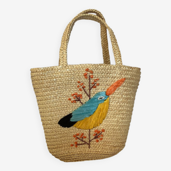 Old woven straw basket embroidered raffia