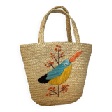 Old woven straw basket embroidered raffia