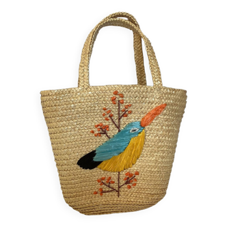 Old woven straw basket embroidered raffia