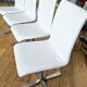 Extendable round table in white formica and 4 matching chairs by Roche Bobois.