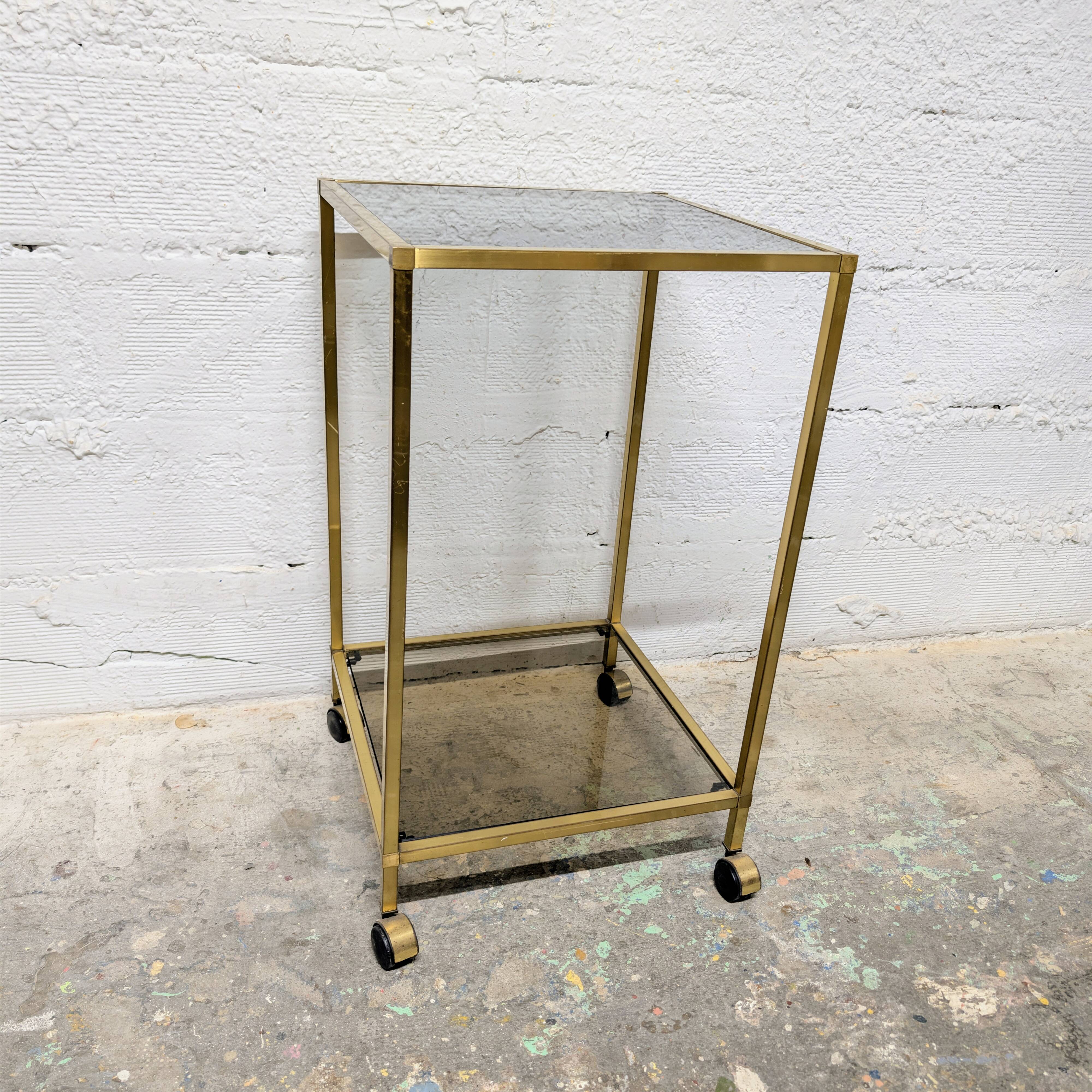 Vintage rolling table in brass and smoked glass